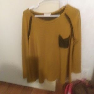 Purchased from olive gold boutique has elbow patc.